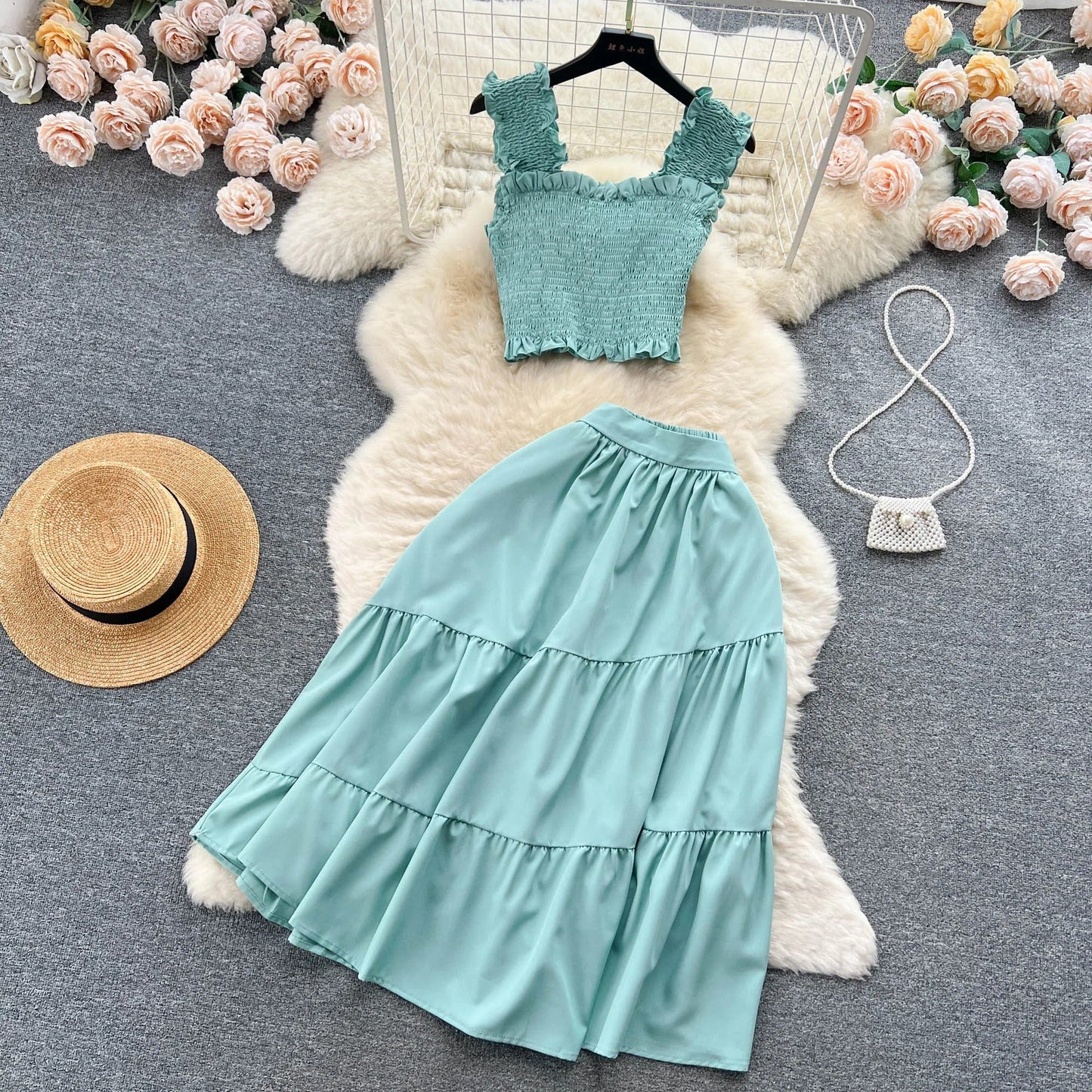 | Sleeveless pleated top and skirt set