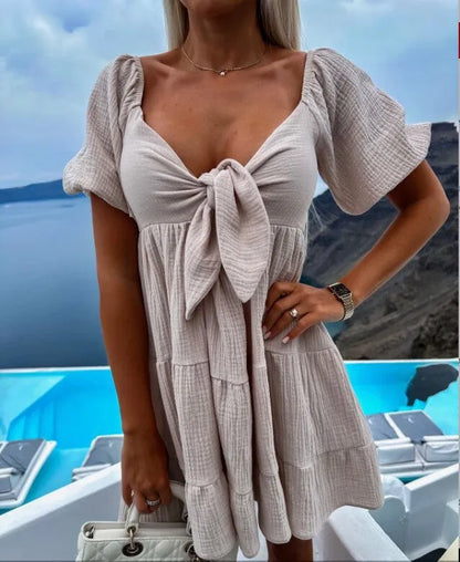Alaia - Short-sleeved dress with V-neck and bow on chest