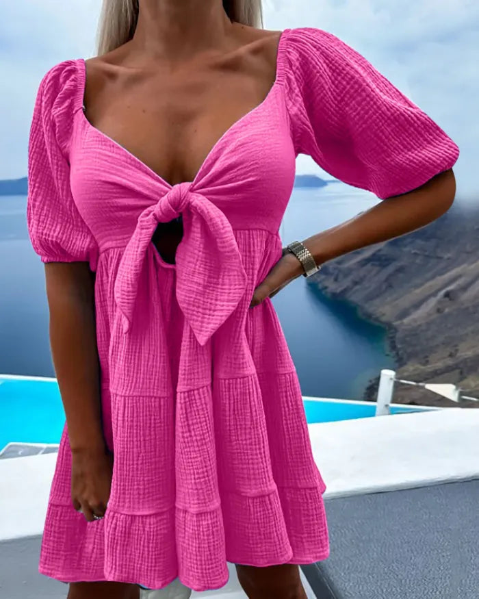 Alaia - Short-sleeved dress with V-neck and bow on chest