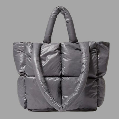 Enna - Stamp-shaped metal carrier bag with gathered design