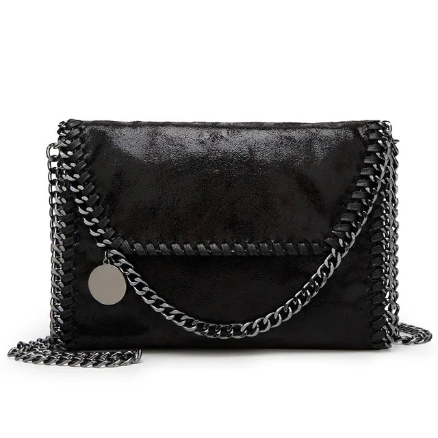 Océane - Suede clutch bag with chain embellishments