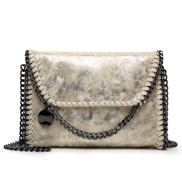 Océane - Suede clutch bag with chain embellishments