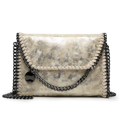 Océane - Suede clutch bag with chain embellishments