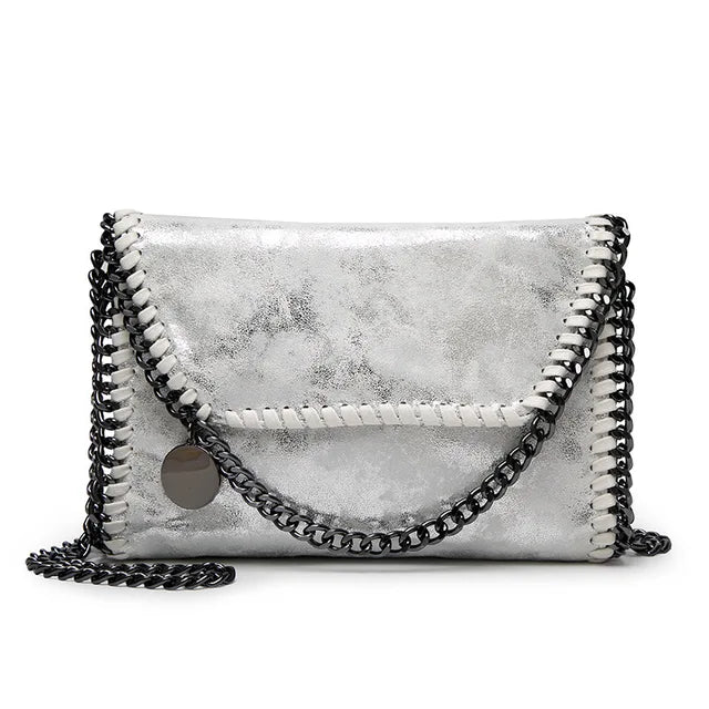 Océane - Suede clutch bag with chain embellishments