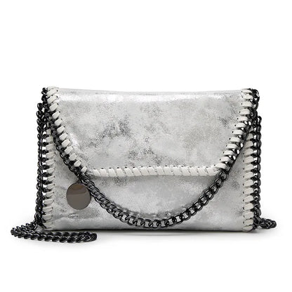 Océane - Suede clutch bag with chain embellishments
