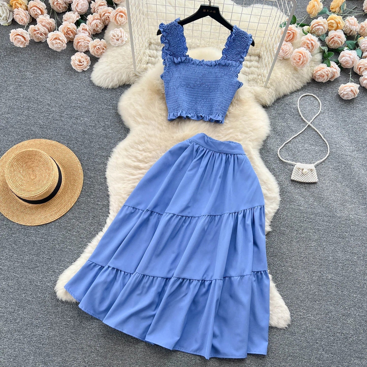 | Sleeveless pleated top and skirt set