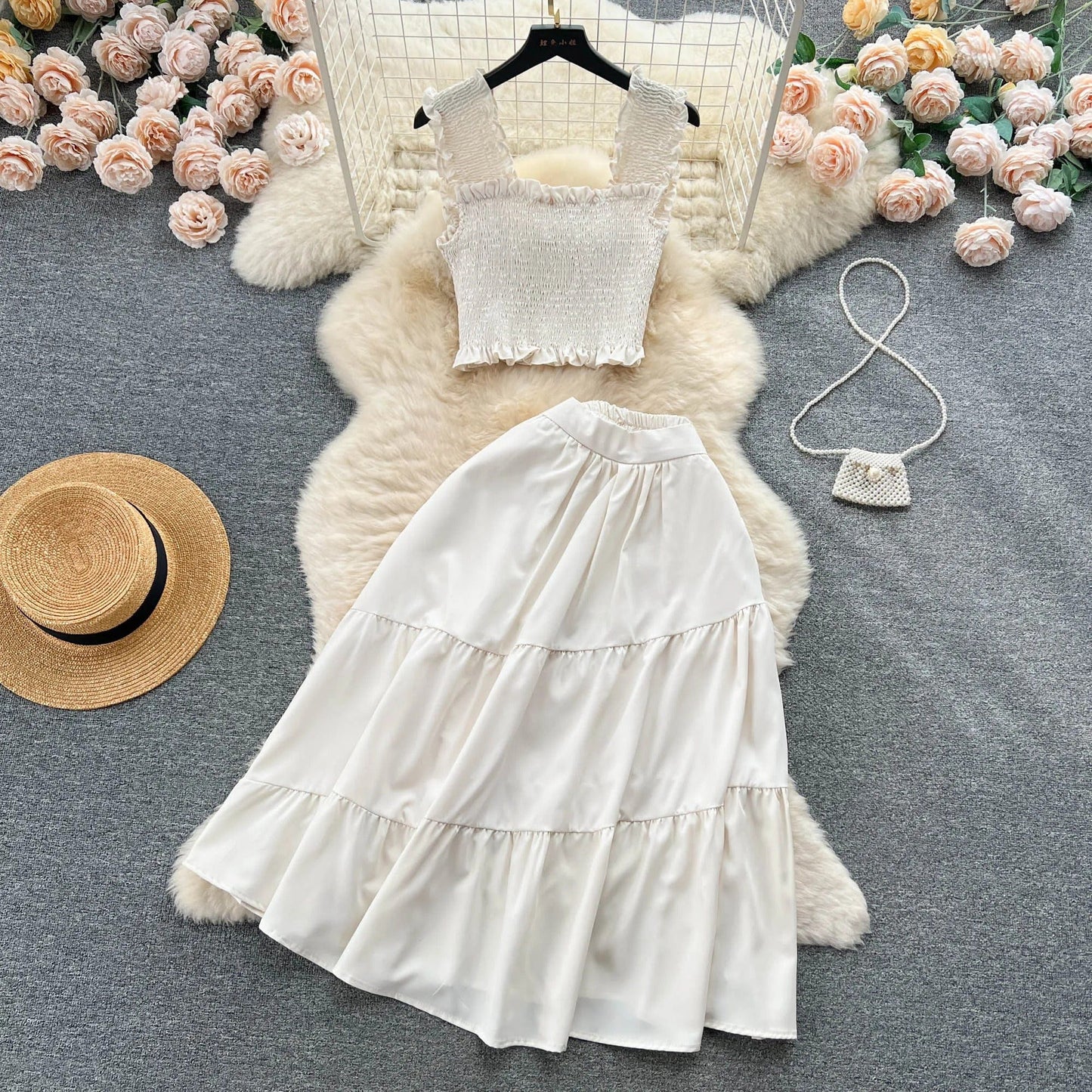 | Sleeveless pleated top and skirt set