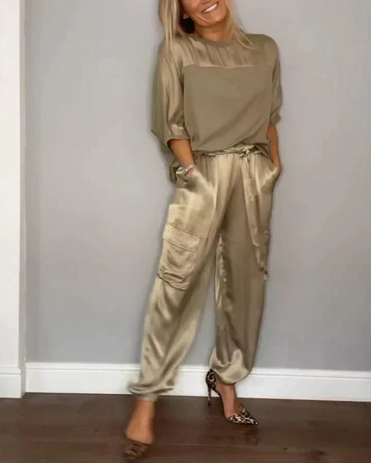 Two-piece costume of smooth satin with half-length top and half-length pants for women