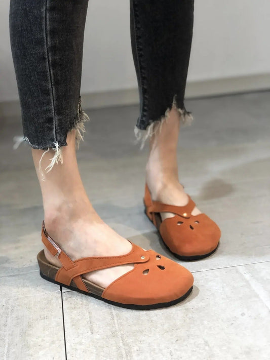 | Strappy sandals with strap closure